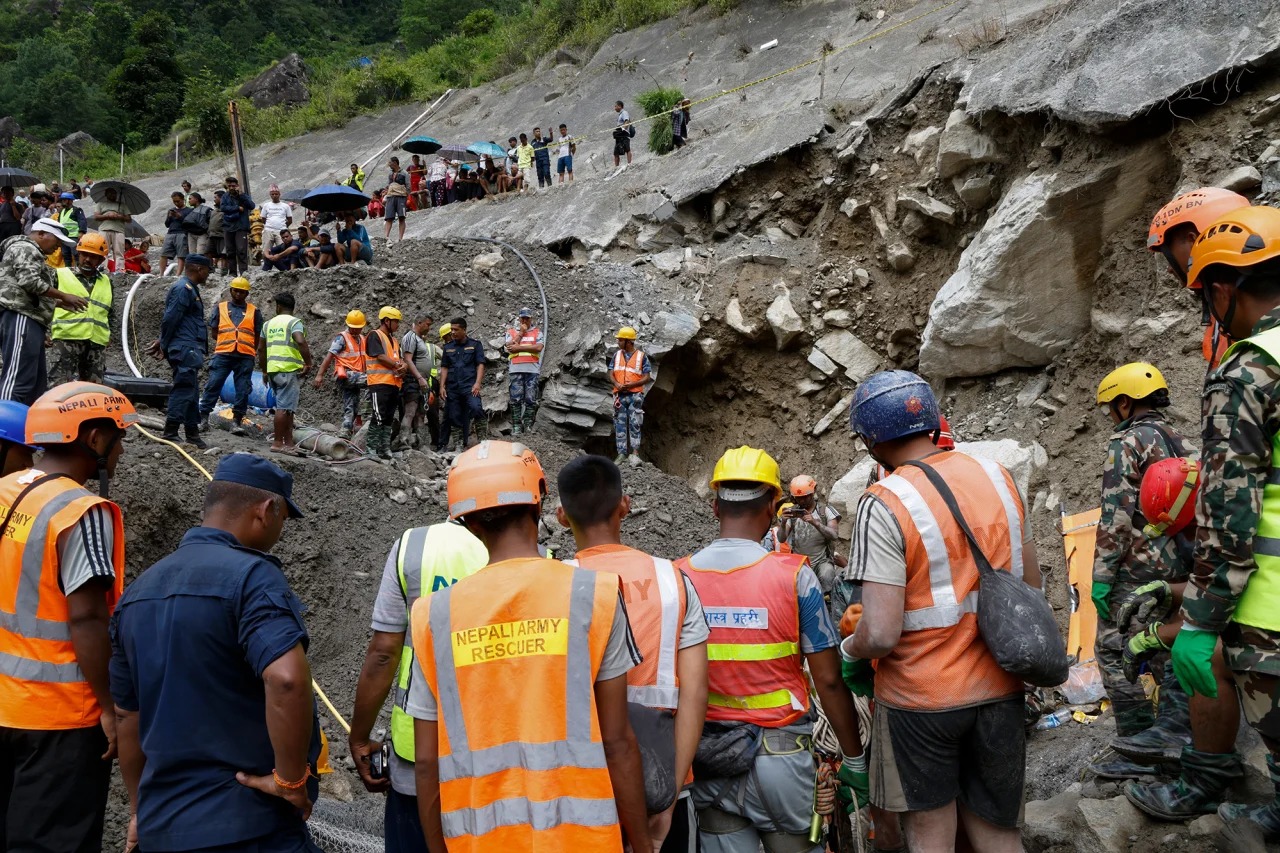 Two men pulled alive from Nepal power plant tunnel nine days after floods

